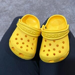 Like new yellow baby crocs. Size 2/3.